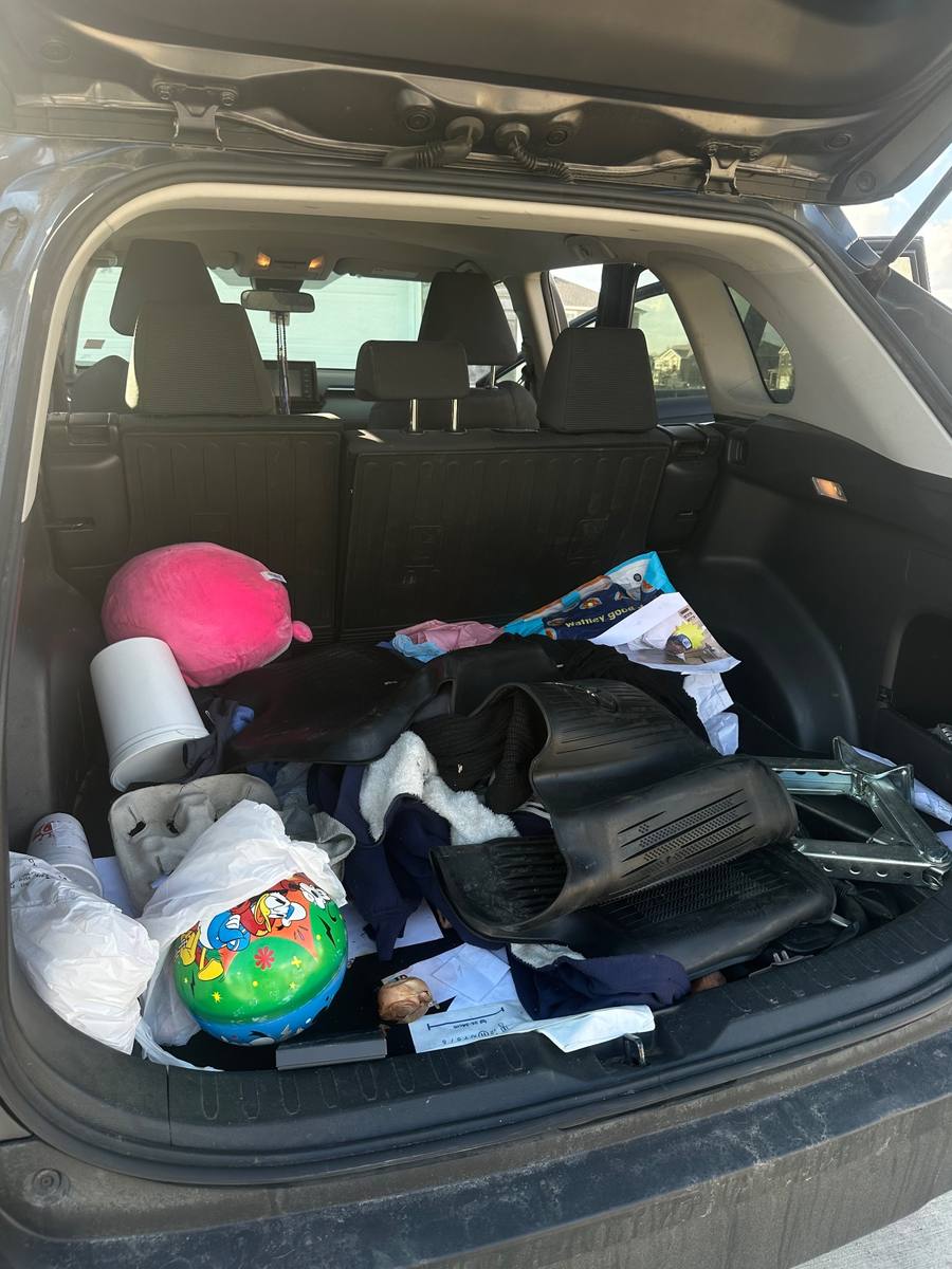 Before — messy SUV trunk